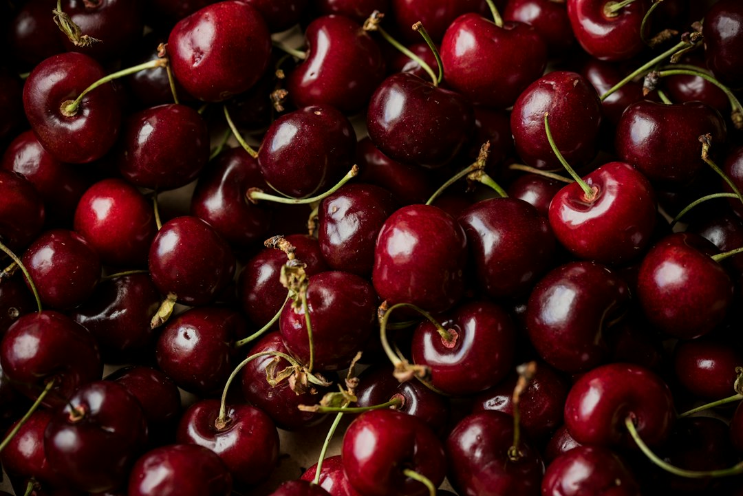 Red cherries illustrating jammy fruit notes in fall perfume