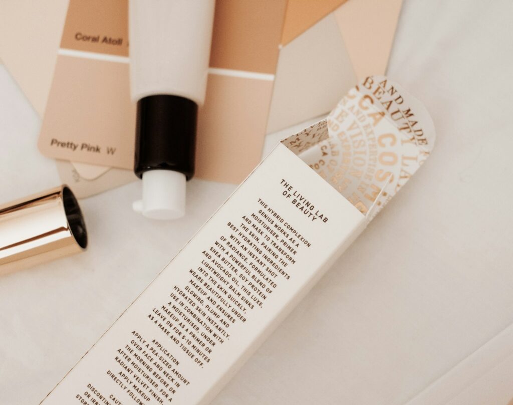Close-up of complexion-product packaging describing its use as a makeup primer