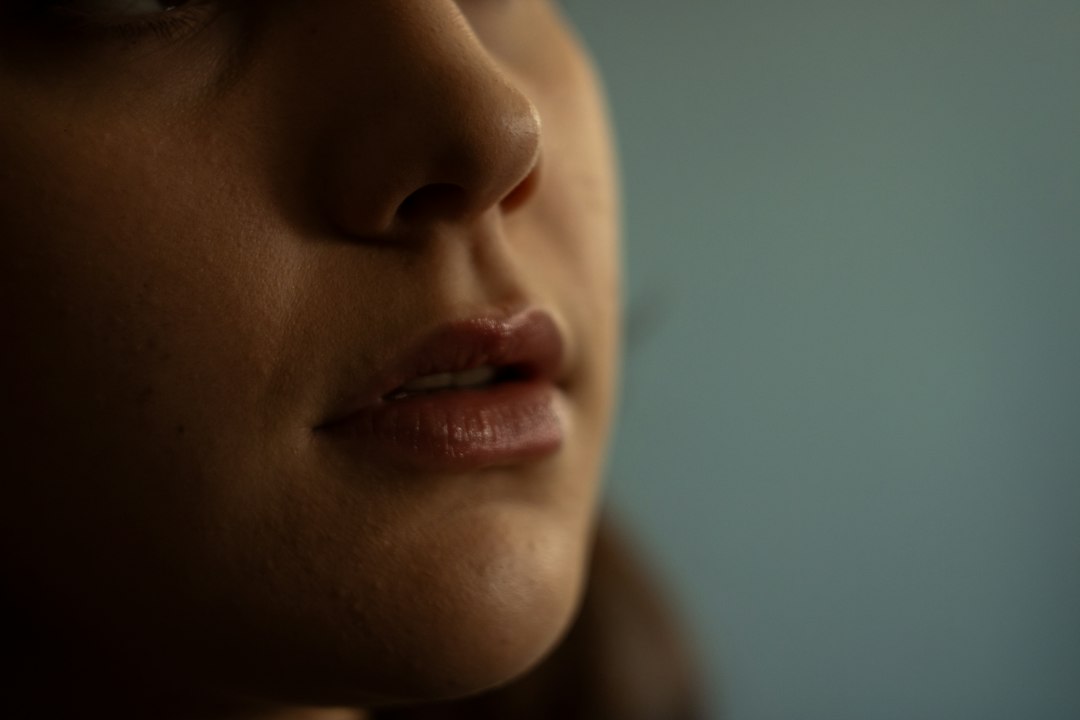 Close-up of glossy tinted lips showing a fresh lip tint finish