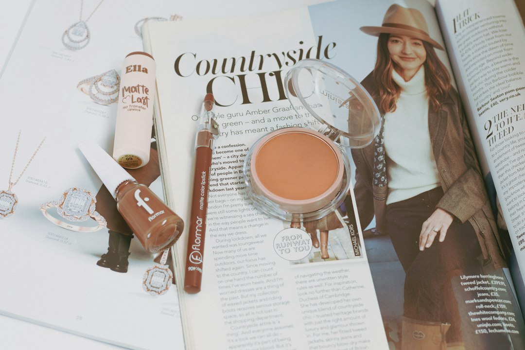 Assorted lip care and beauty products styled in an editorial flat lay