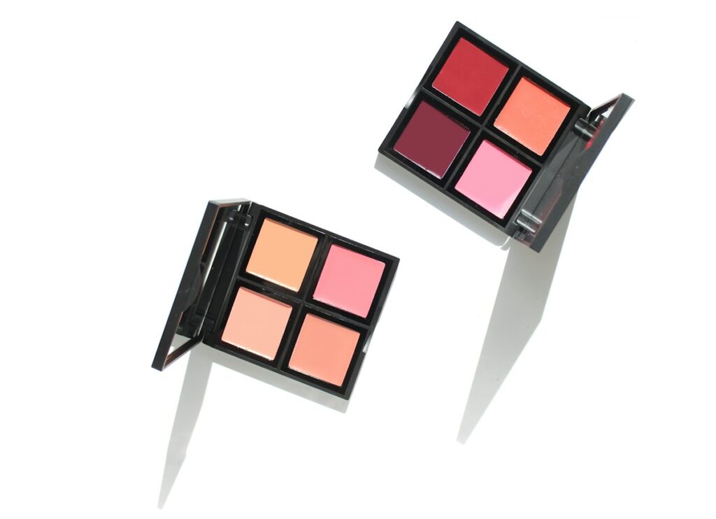 Open cream blush and lip color palettes with pink, rose and warm shades